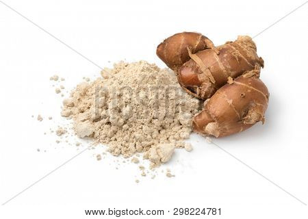 Fresh raw kencur rhizome and heap of dried powder isolated on white background