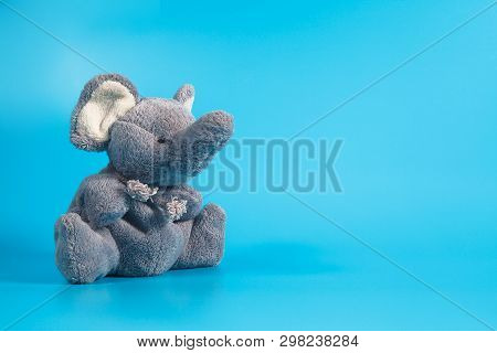 Funny Cute Grey Gray Plush Elephant Toy Isolated On Golor Background. Isolated, Blue, Red, White. Co