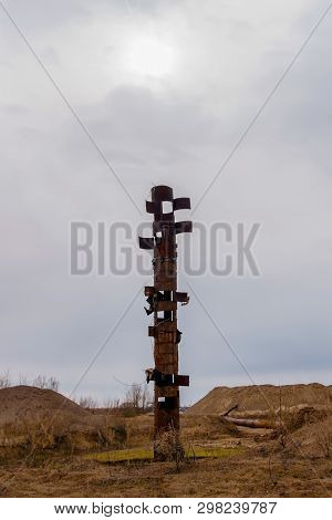 Strange Rusty Pipe Sticks Out In The Middle Of A Wasteland, Resembling A Totem Pole