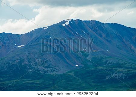 Amazing Giant Mountain With Snow On Top In Mist In Overcast Weather. Huge Snowy Mountain In Haze Und