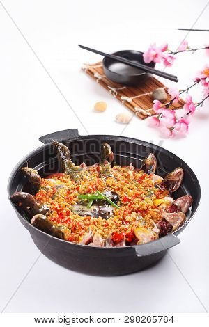 Stewed Yellow Croaker In A Black Ceramic Dish