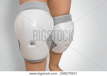 Pair Of Knee Pads Wearing On Legs Of Child