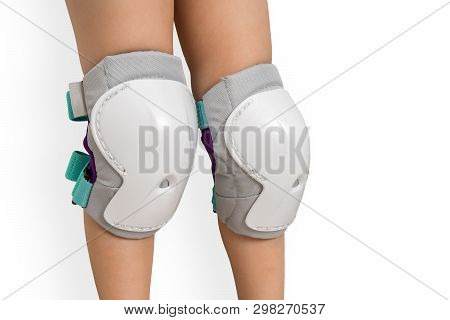 Pair Of Knee Pads Wearing On Legs Of Child