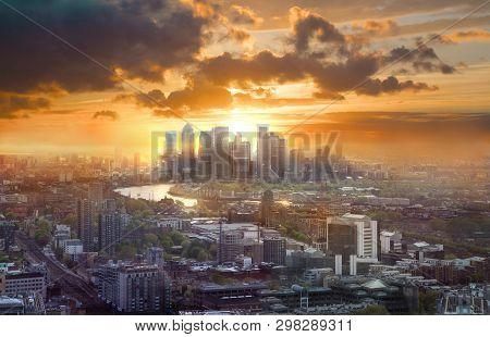 Canary Wharf At Sunset, London, Uk. Skyline View Of The Famous Financial Bank District At Golden Sun