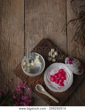 Thapthim Krop, Mock Pomegranate Seeds In Coconut And Syrup In The White Bowl On The Wood Table There