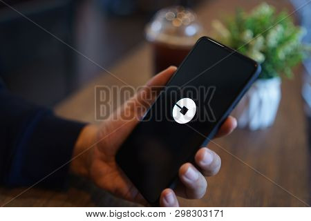 Chiang Mai, Thailand - Mar. 24,2019: Man Holding Xiaomi Mi Mix 3 With Uber Apps. Uber Is Smartphone 