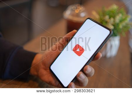 Chiang Mai, Thailand - Mar. 24,2019: Man Holding Xiaomi Mi Mix 3 With Youtube Apps On Screen. Youtub