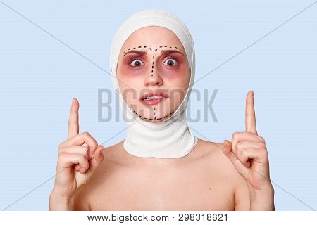Closeup Of Female Facial Expressing . Surprised, Scered And Shocked Lady Waits For Medical Procedure