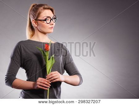 Delicacy And Subtlety Of Women. Young Adorable Woman With Spring Flower. Portrait Of Beauty Delicate