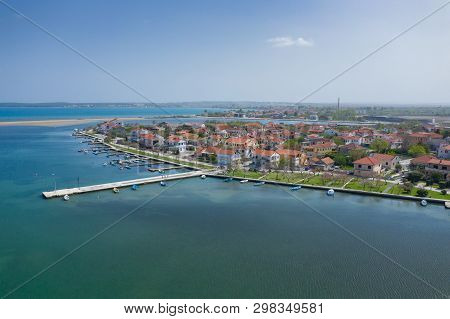 Aerial View Of City Of Nin. Summer Time In Dalmatia Region Of Croatia. Coastline And Turquoise Water