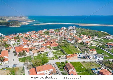 Aerial View Of City Of Nin. Summer Time In Dalmatia Region Of Croatia. Coastline And Turquoise Water