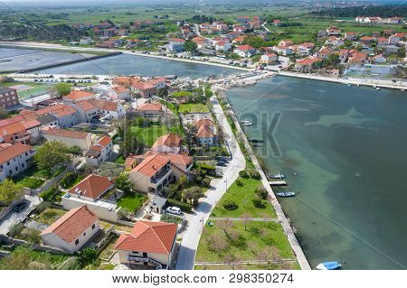 Aerial View Of City Of Nin. Summer Time In Dalmatia Region Of Croatia. Coastline And Turquoise Water