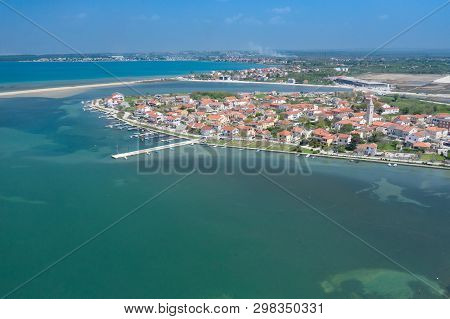 Aerial View Of City Of Nin. Summer Time In Dalmatia Region Of Croatia. Coastline And Turquoise Water
