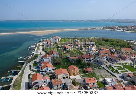 Aerial View Of City Of Nin. Summer Time In Dalmatia Region Of Croatia. Coastline And Turquoise Water