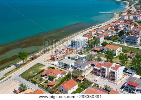 Aerial View Of City Of Nin. Summer Time In Dalmatia Region Of Croatia. Coastline And Turquoise Water