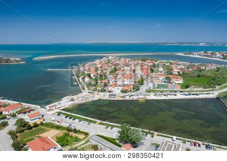 Aerial View Of City Of Nin. Summer Time In Dalmatia Region Of Croatia. Coastline And Turquoise Water