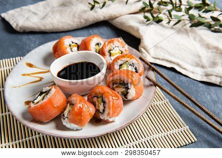 Philadelphia Roll Sushi With Salmon And Cucumber Served On The Plate With Soe Sauce. Japanese Food. 