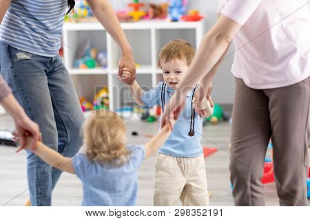 Little Children And Their Mothers Roundelay In Daycare