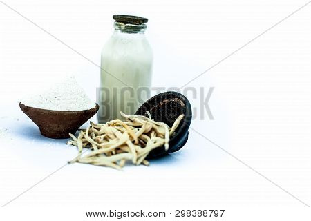 Popular Indian & Asian Ayurvedic Herb Isolated On White In A Clay Bowl I.e. Musli Or Safed Musli Or