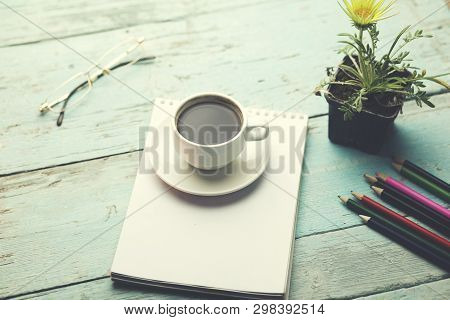 Cup Of Coffee On Notepad With Sationary