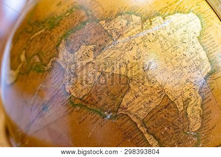 Radun Castle, Czech Republic, 7 April 2019 - Old Globe On Bookshelf Background With Selective Focus 