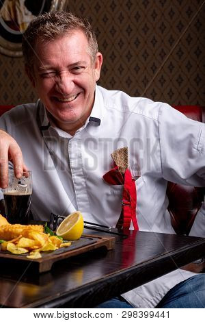 Fabulous At Any Age. Portrait Of Fashionable 50-year-old Man In Stylish Siut Posing At Restaurant. T