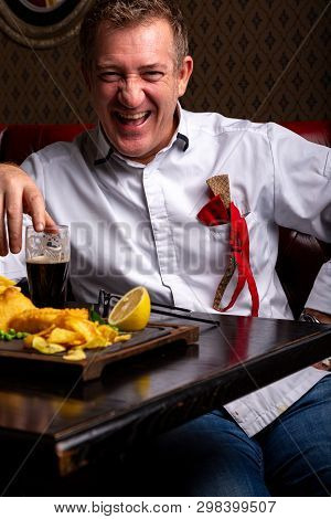 Fabulous At Any Age. Portrait Of Fashionable 50-year-old Man In Stylish Siut Posing At Restaurant. T
