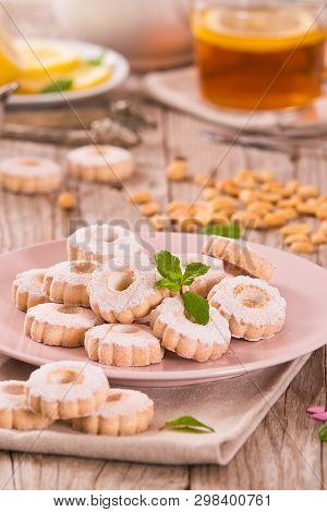 Canestrelli Biscuits With Mint On Wooden Table.