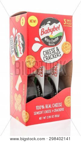 Winneconne, Wi -  22 April 2019: A Package Of Babybel White Cheddar Cheese And Crackers On An Isolat