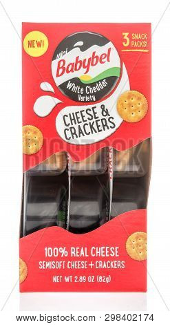 Winneconne, Wi -  22 April 2019: A Package Of Babybel White Cheddar Cheese And Crackers On An Isolat