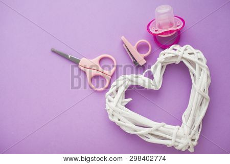 Newborn Baby Story. Strow Heart And Childrens Toys, Scissors, Baby Bottle, Nipple, Hairbrush On Viol