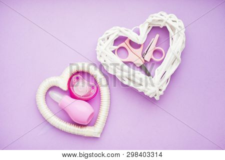 Newborn Baby Story. Strow Heart And Childrens Toys, Scissors, Baby Bottle, Nipple, Hairbrush On Viol