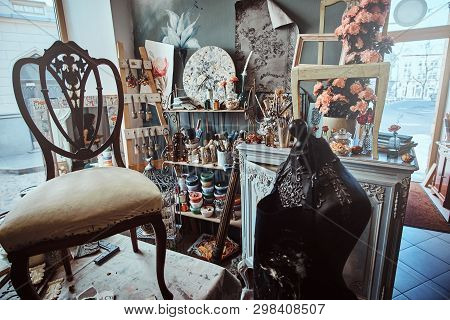 Artists Workshop With Necessary Eguipment  Like Paint, Brushes, Frames, Flowers, Table,  Chair And M