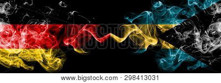 Germany Vs Bahamas, Bahamian Smoky Mystic Flags Placed Side By Side. Thick Colored Silky Smoke Flags