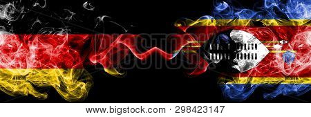 Germany Vs Swaziland, Swazi Smoky Mystic Flags Placed Side By Side. Thick Colored Silky Smoke Flags 