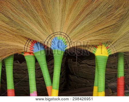 Colourful Brooms For Sale In A Local Village Shop In Salay, Myanmar.