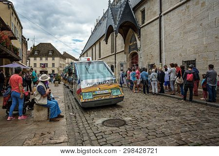 Beaune, France - August 10, 2017: Excursion Car In The City Of Beaune Near The Famous Building Hotel