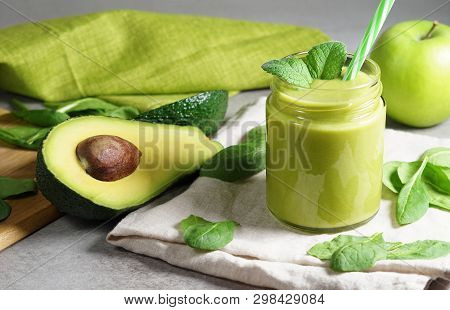 Avocado Spinach And Green Apple Smoothie Healthy And Refreshing Tropical Drink Front View Of A Glass