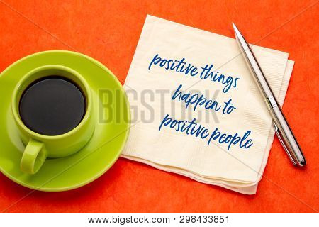 positive things happen to positive people - handwriting on a napkin with a cup of coffee, law of attraction concept