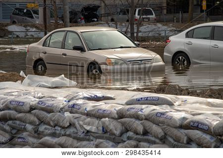 Pierrefonds-roxboro, Quebec, Canada - 29 April 2019: Cars Submerged During Spring Floods