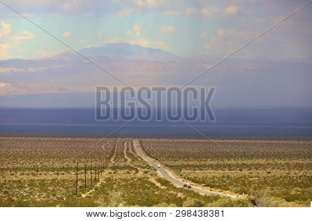 Thunderstorm With Downdrafts Of Rain Taken Over An Arid Plain In The Rural Mojave Desert, Ca
