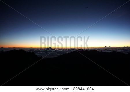 Waiting For Sunrise At The Top Of Haleakalā Volcano In Maui