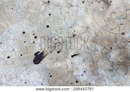 Cracking Pattern Of Concrete Surface And Dripped Of Black Paint. Gray Cement Wall Or Floor Backgroun
