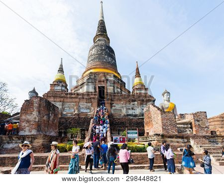 People Visiting The Temple Of Ayutthaya Historical Park On Thailand.