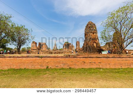 People Visiting The Temple Of Ayutthaya Historical Park On Thailand..
