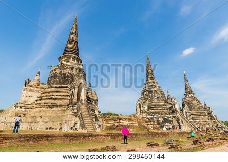 People Visiting The Temple Of Ayutthaya Historical Park On Thailand.