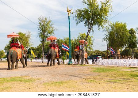 Tourists On An Elephant Ride Tour Of The Ancient City Ayutaya ,thailand..