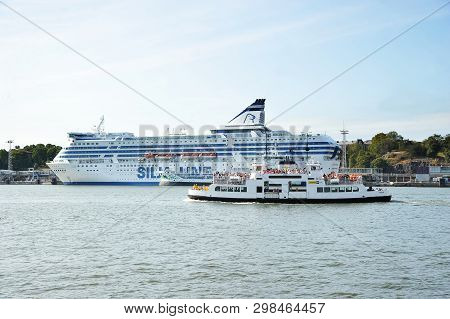 Helsinki, Finland - August 16, 2018: Cruise Liner Silja Line And Pleasure Boat On The Waterfront In 