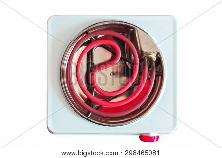 Small Electric Stove For Cooking. Portable Household Appliances. The Metal Spiral Is Red Hot