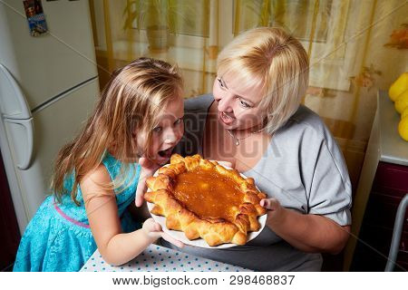 Kirov, Russia - November 04, 2018: Adalt Mother And Her Young Daughter In A Kitchen